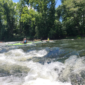 White caps and tides with Kayaks going over them
